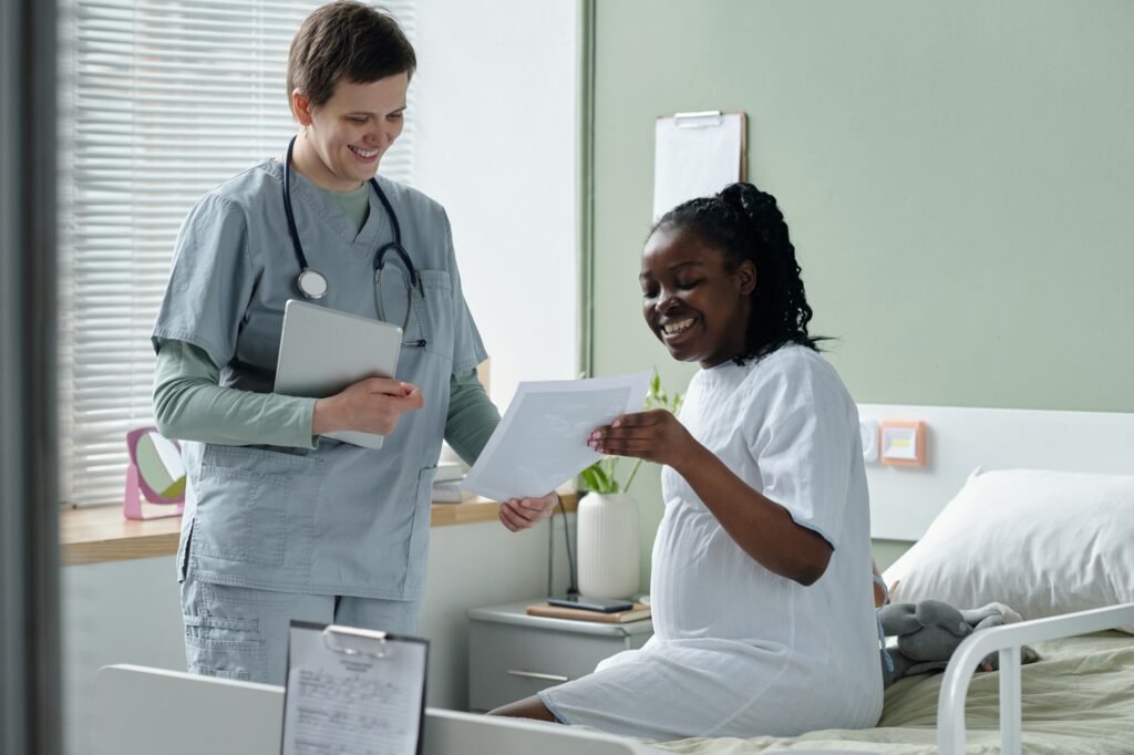 Doctor and Patient Smiling While Discussing Health Plans