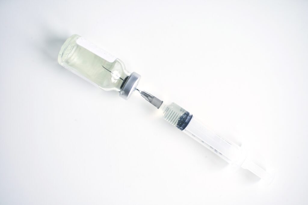 Magical vaccine vial dose flu shot drug needle syringe,medical concept vaccination hypodermic